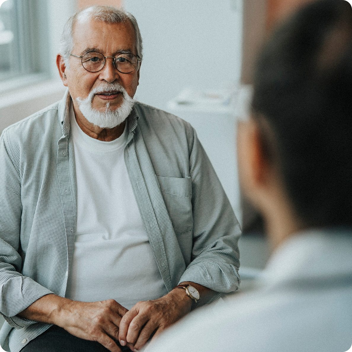 A patient consults his doctor during transplant care, supported by Astellas' immunology treatments for long-term success.