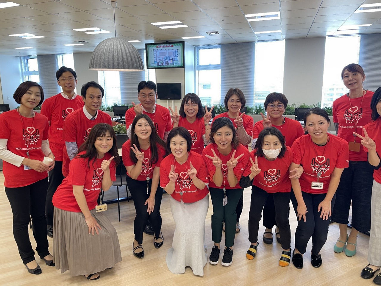 Astellas employees in Japan smiling for a picture while volunteering at a local hospital.
