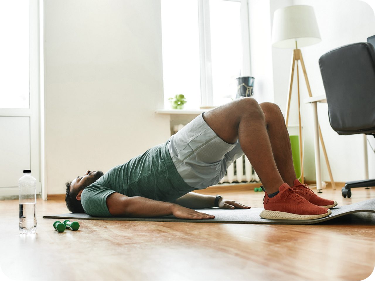 Image of a man doing floor exercises on a mat